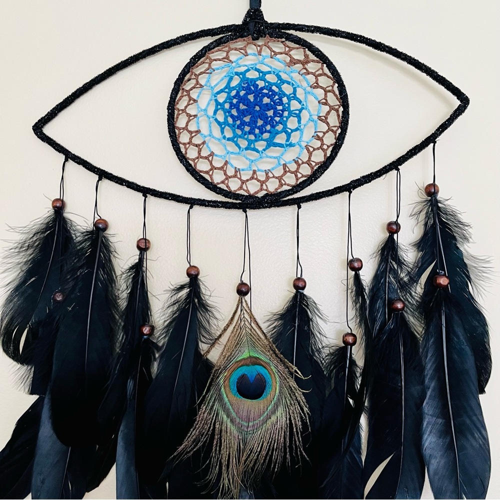 Macrame and feather eye wall decor